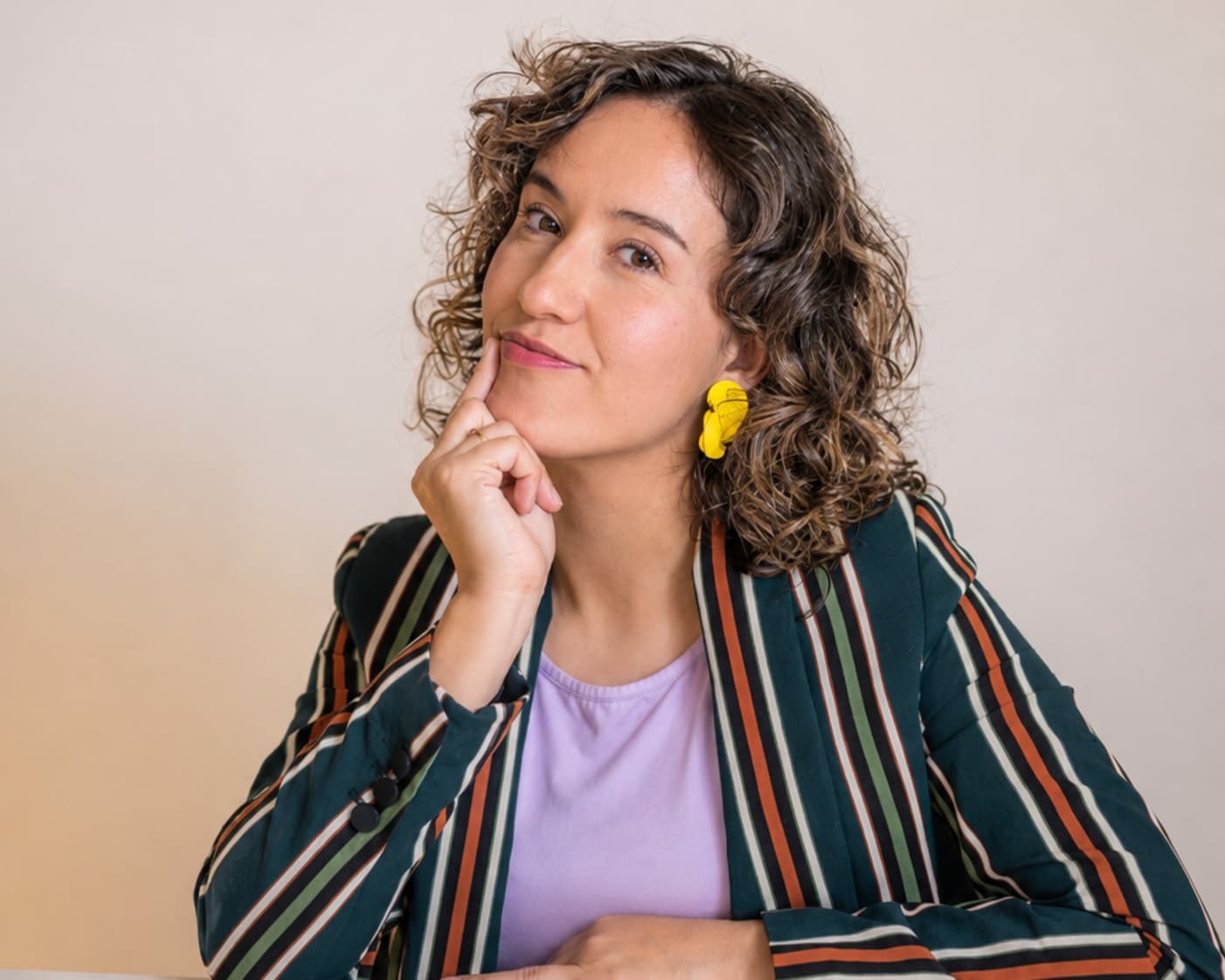 Ashley Leon at her desk with her laptop